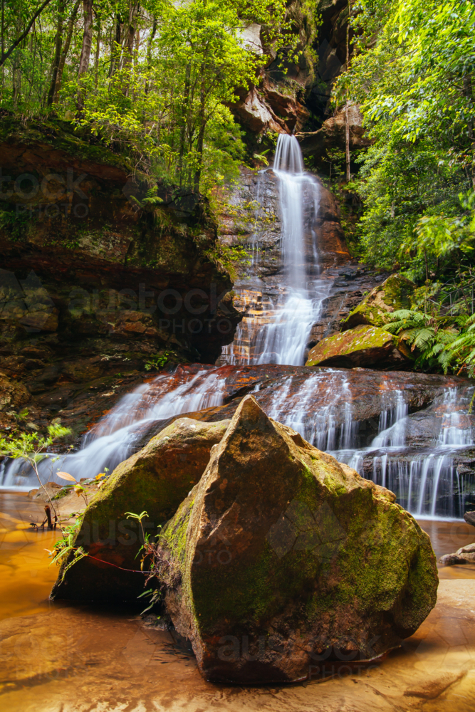 Water cascading over rocks early in the morning in Leura Cascades, New South Wales, Australia - Australian Stock Image