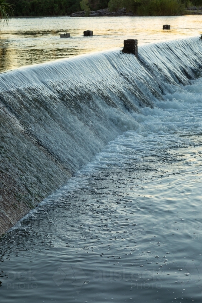 water cascading over the Ivanhoe crossing near Kununurra - Australian Stock Image