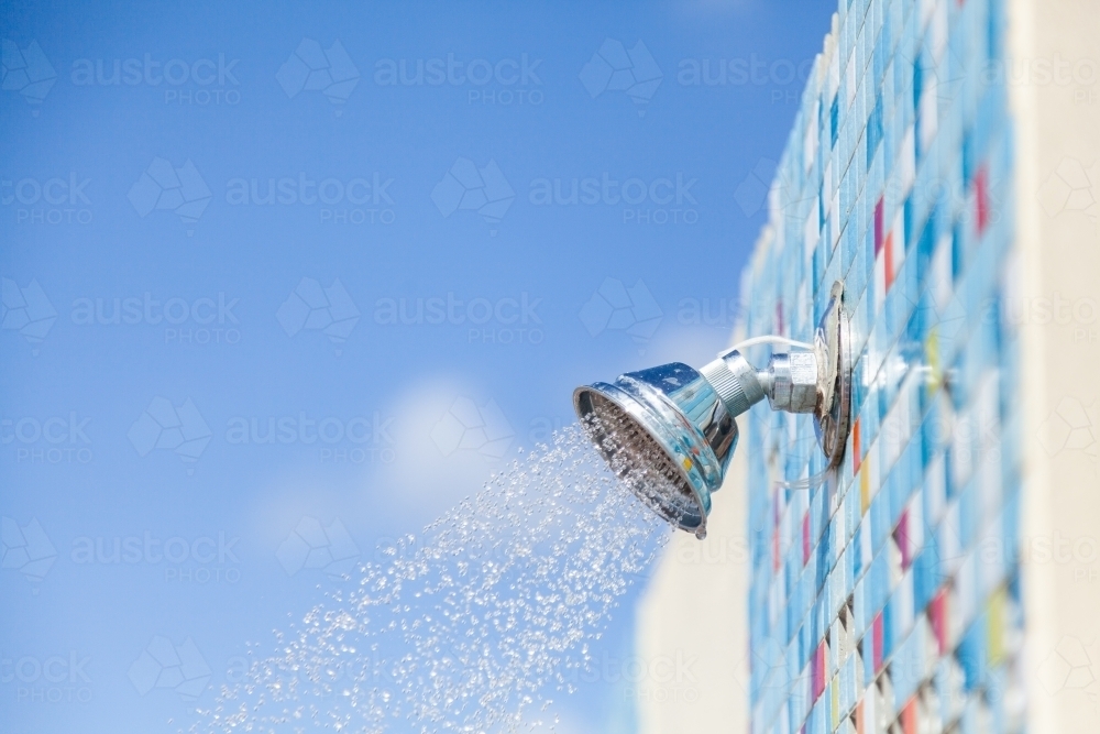 Water from beach rinse off shower head - Australian Stock Image