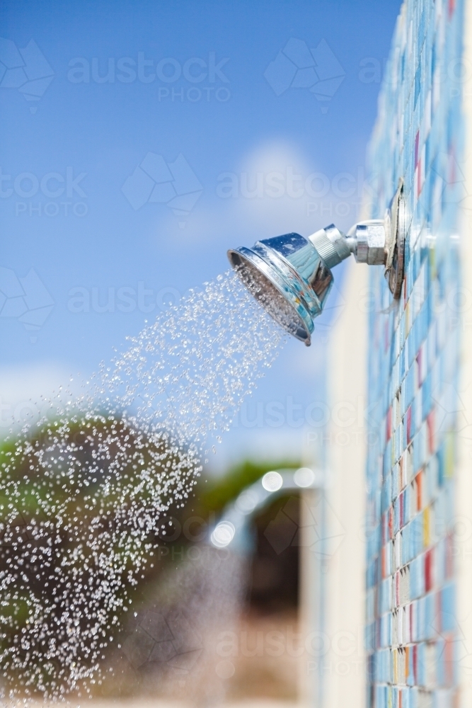Water from outdoor shower at beach - Australian Stock Image