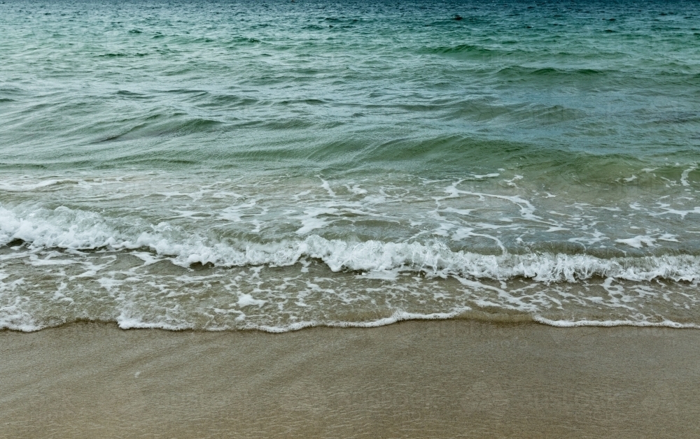 Water lapping on the seashore - Australian Stock Image