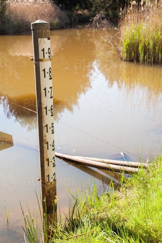 Water level depth indicator in a regional creek crossing - Australian Stock Image