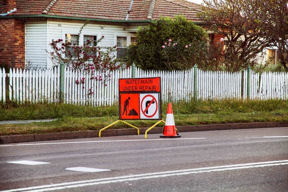 Water Main under repair sign on the roadside - Australian Stock Image