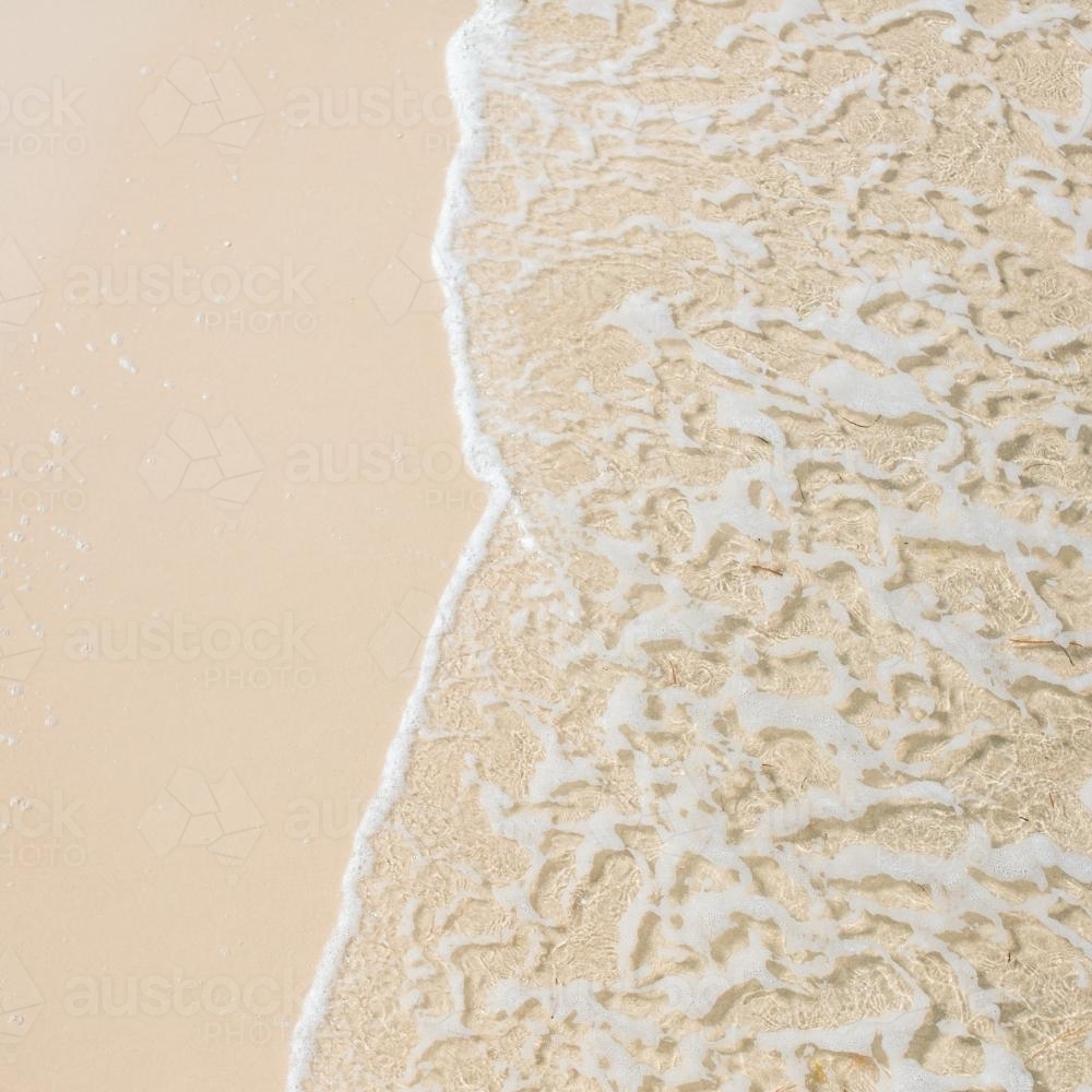 Water on a sandy beach - Australian Stock Image