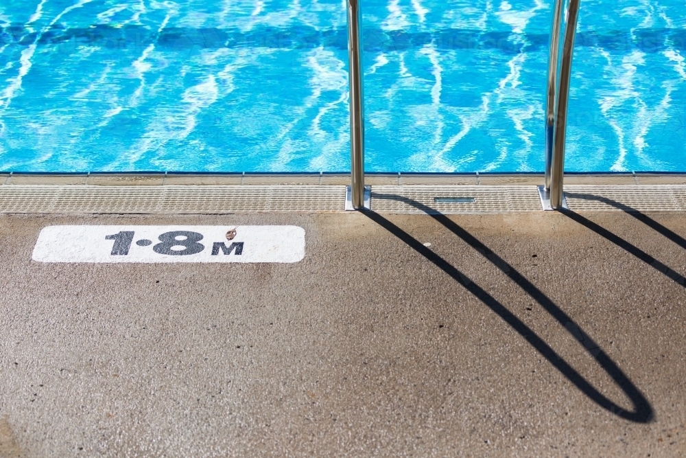 Water ripples in a pool with depth measurement - Australian Stock Image