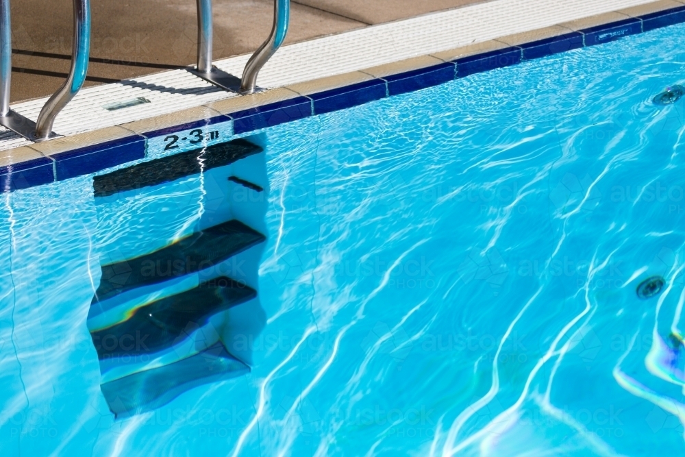 Water ripples in a pool with stairs - Australian Stock Image