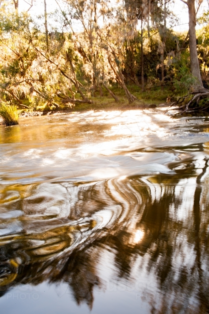 Water ripples in a river - Australian Stock Image