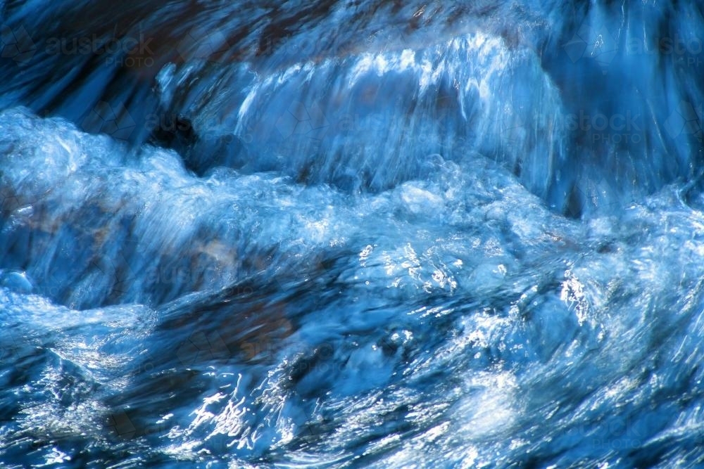 Water rushing down a stream - Australian Stock Image