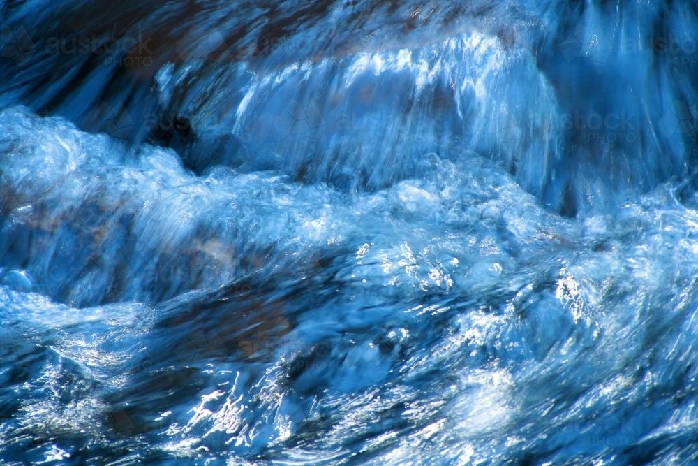 Image of Water rushing down a stream - Austockphoto