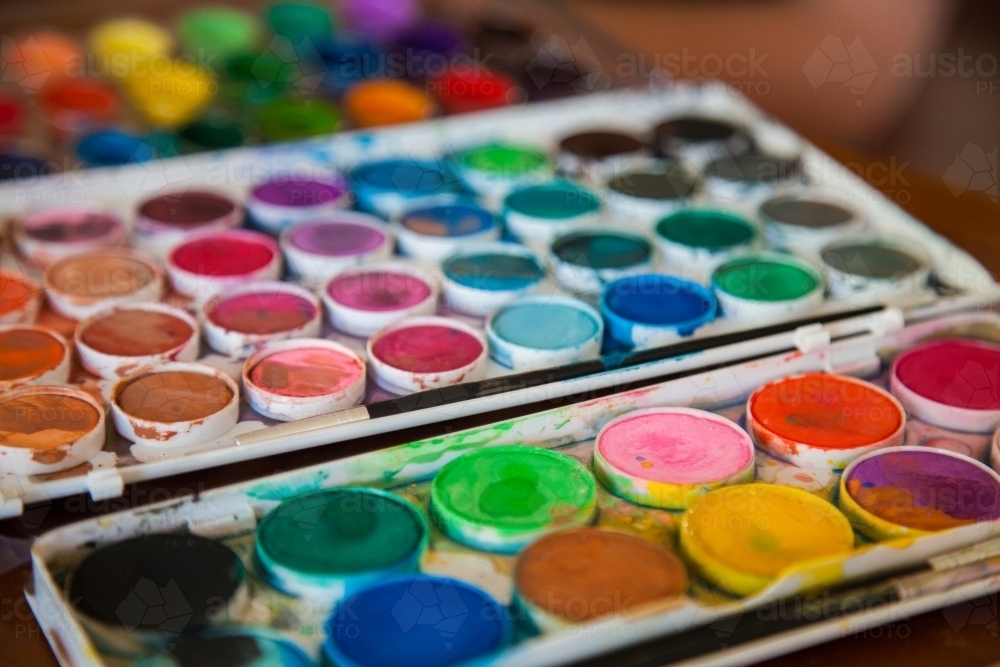 Watercolour art palette with bright paint colours - Australian Stock Image