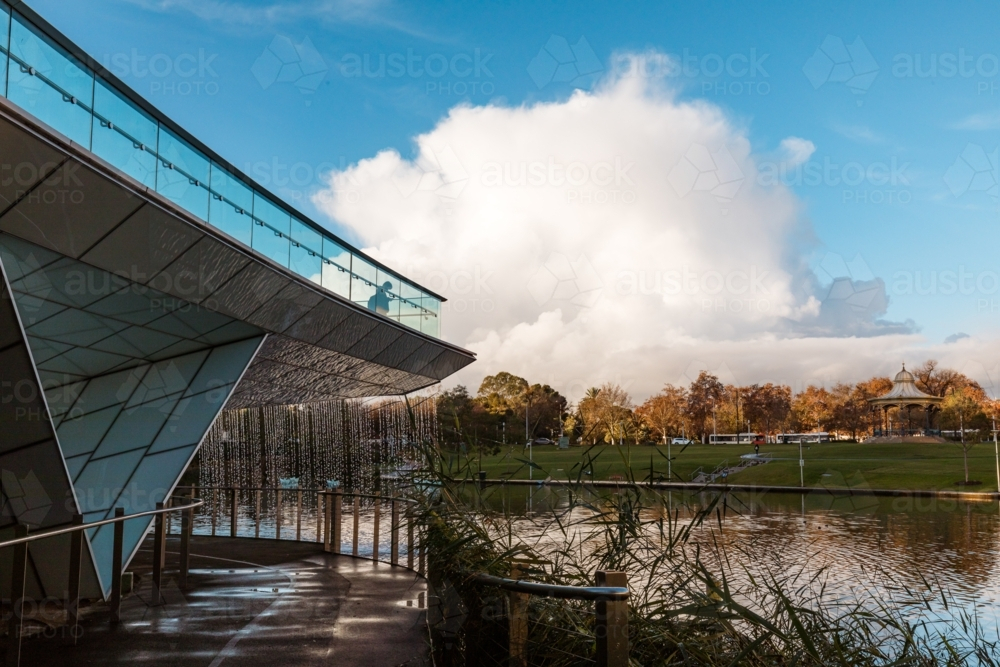 Waterfall water feature at end of The Riverbank Precinct Bridge on the Torrens River - Australian Stock Image