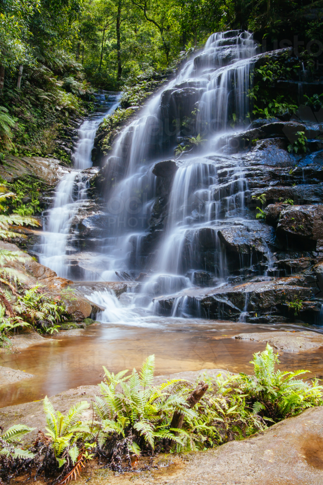 Waterfalls cascading over rocks in Wentworth Falls, New South Wales, Australia - Australian Stock Image