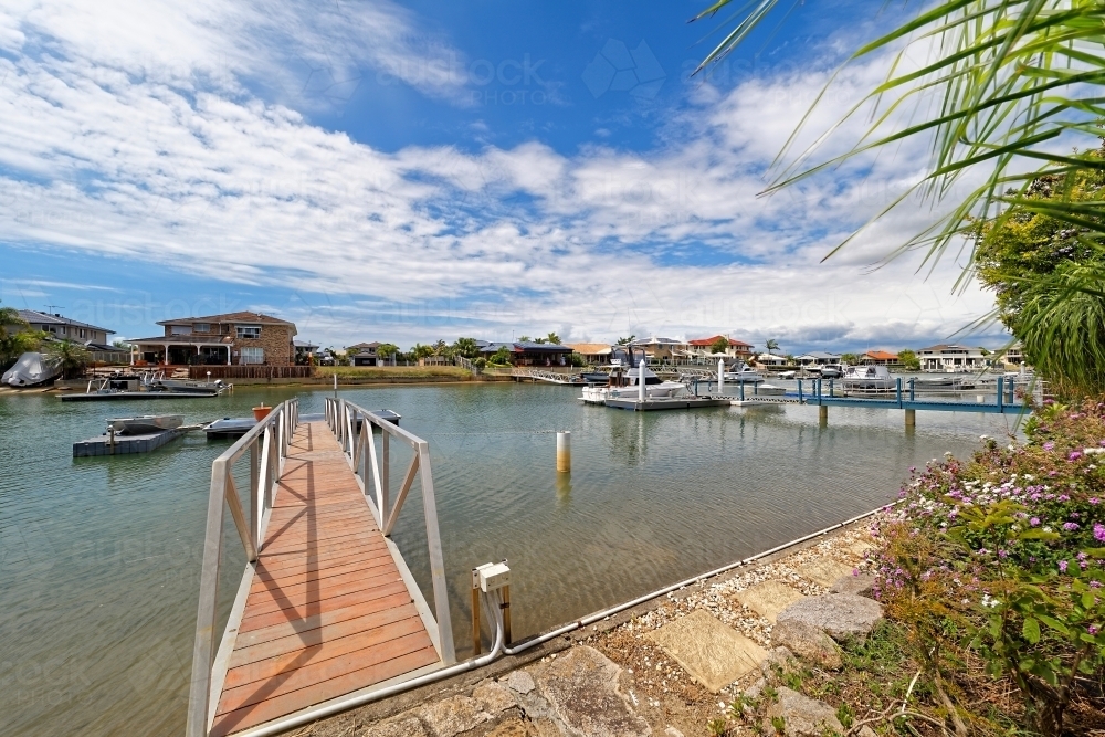 Waterfront properties with private jetty in Newport, Queensland - Australian Stock Image