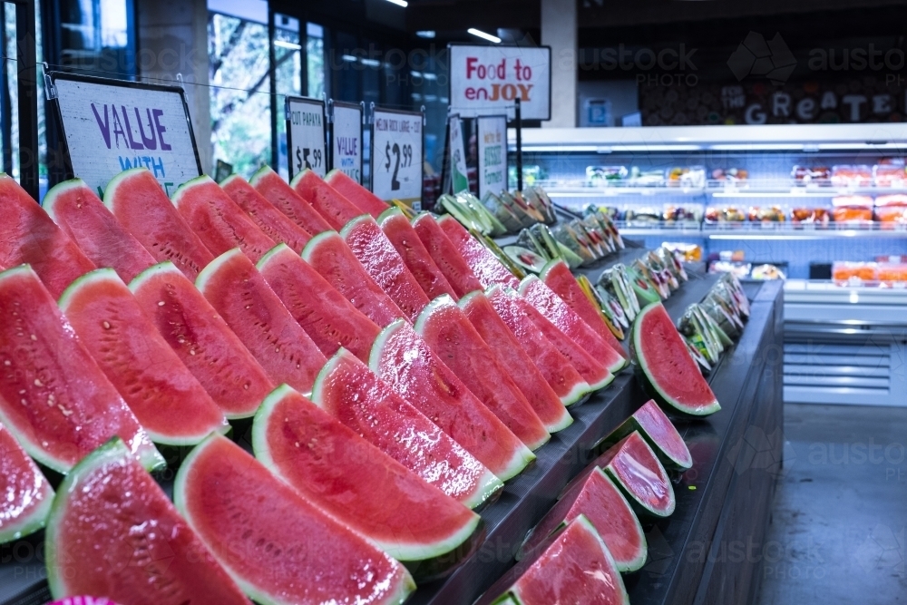 Watermelon In Store Image of watermelon for sale at a green grocer - Austockphoto
