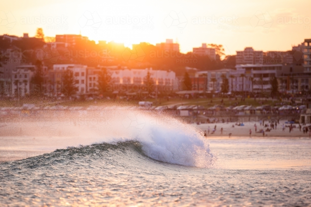 Wave crashing at sunset at Bondi Beach - Australian Stock Image