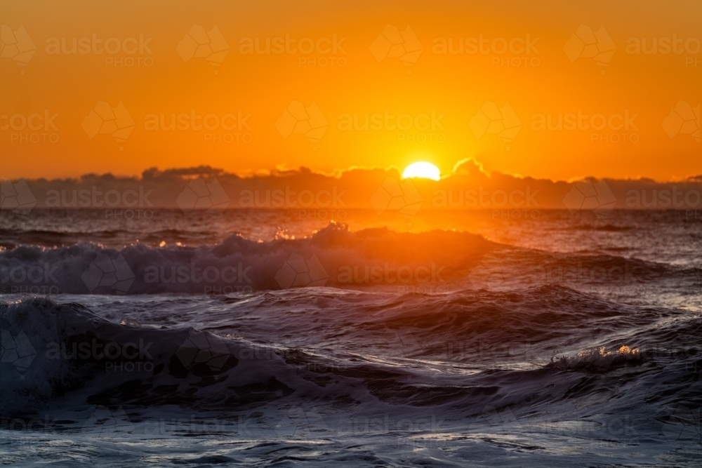 waves and beach at sunrise - Australian Stock Image