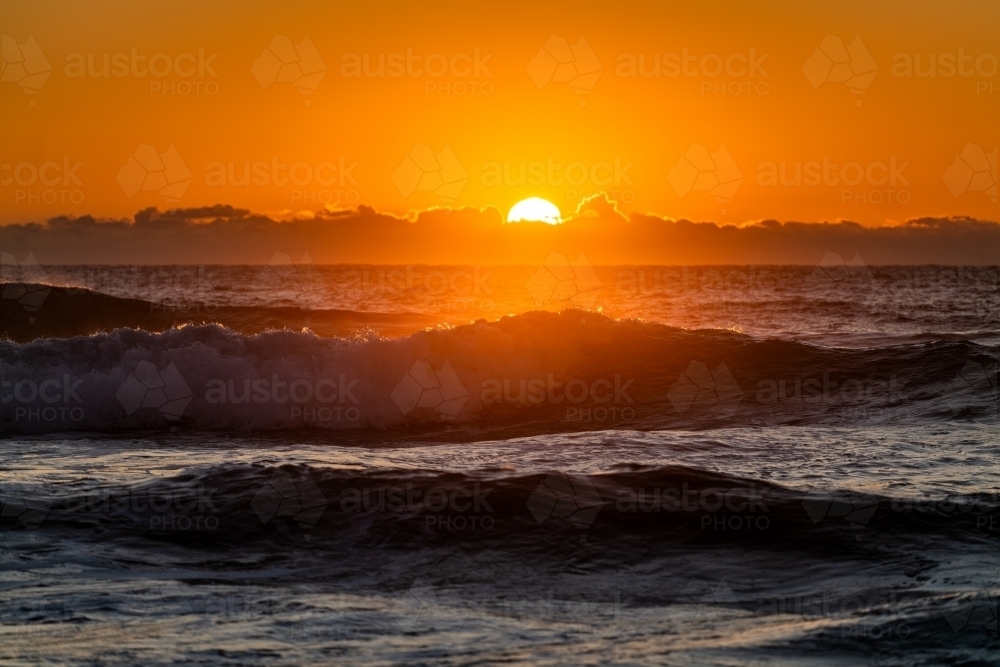 waves and beach at sunrise - Australian Stock Image