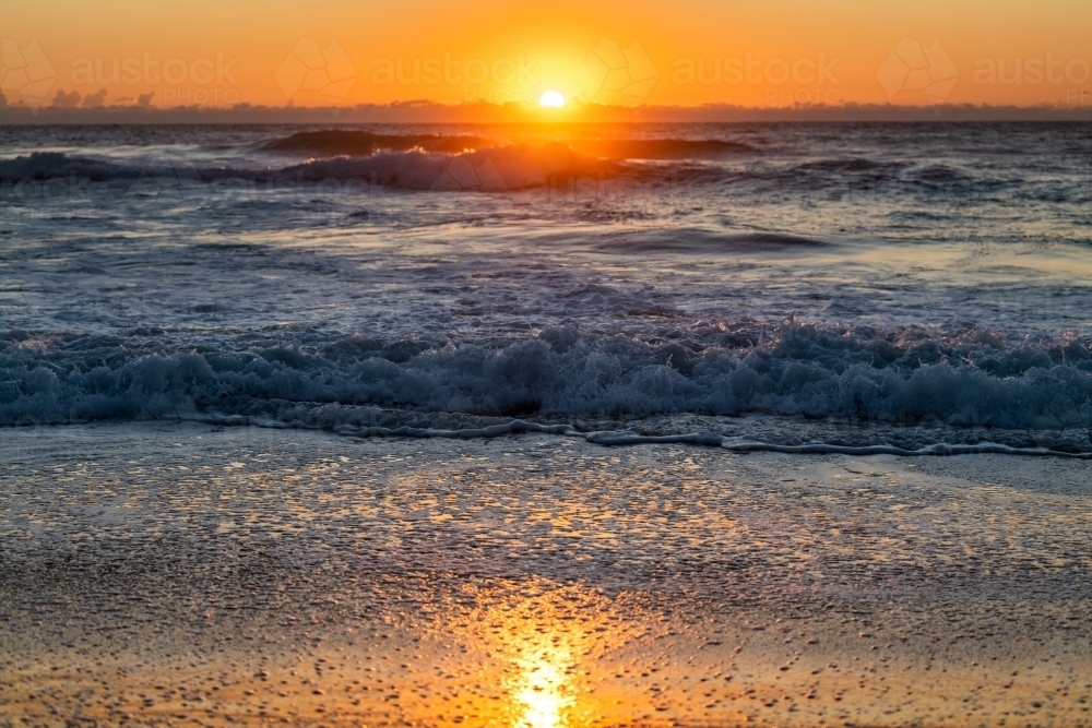 waves and beach at sunrise - Australian Stock Image
