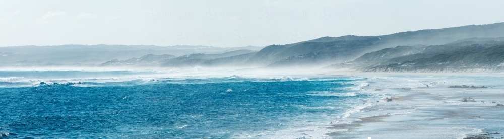 waves breaking on rocky reef - Australian Stock Image