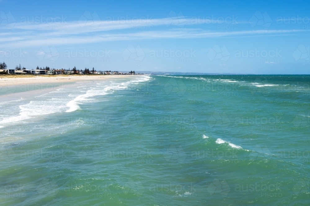 waves breaking on sandbar at a city beach - Australian Stock Image