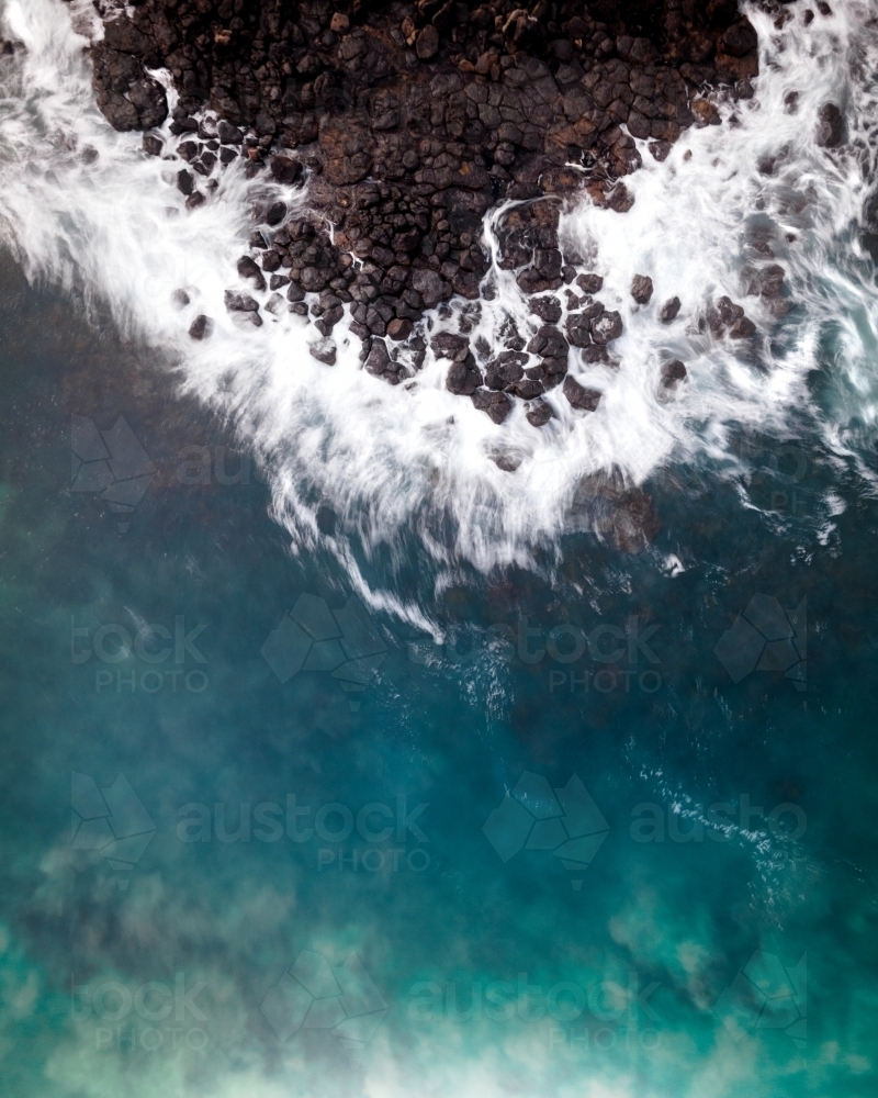 Waves Crashing on a Rocky Beach - Aerial - Australian Stock Image