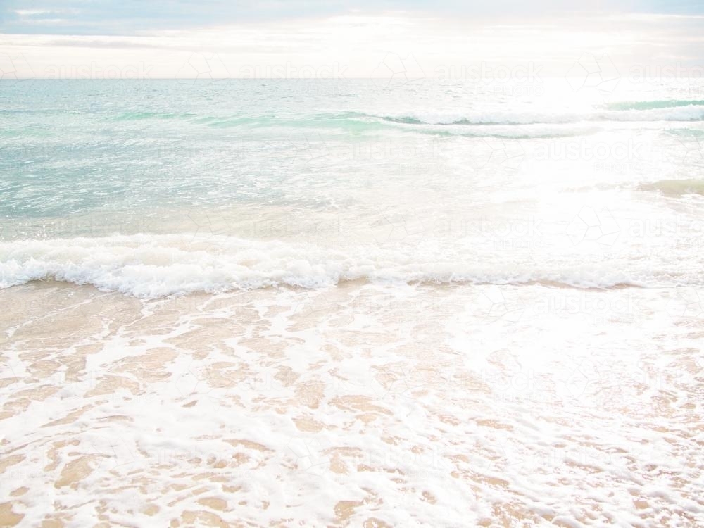 Waves crashing on beach - Australian Stock Image