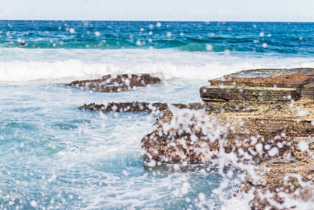 waves crashing on rocks - Australian Stock Image