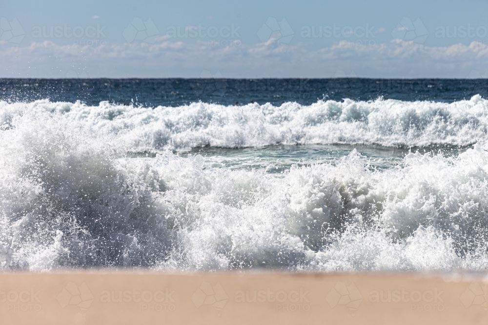 Waves crashing on shore - Australian Stock Image