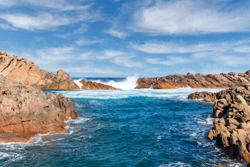 Waves crashing over Canal Rocks Yallingup Western Australia - Australian Stock Image
