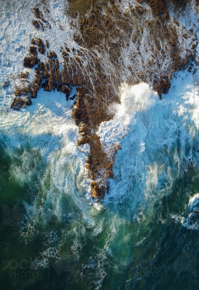 Waves Crashing over Rocks Aerial View - Australian Stock Image
