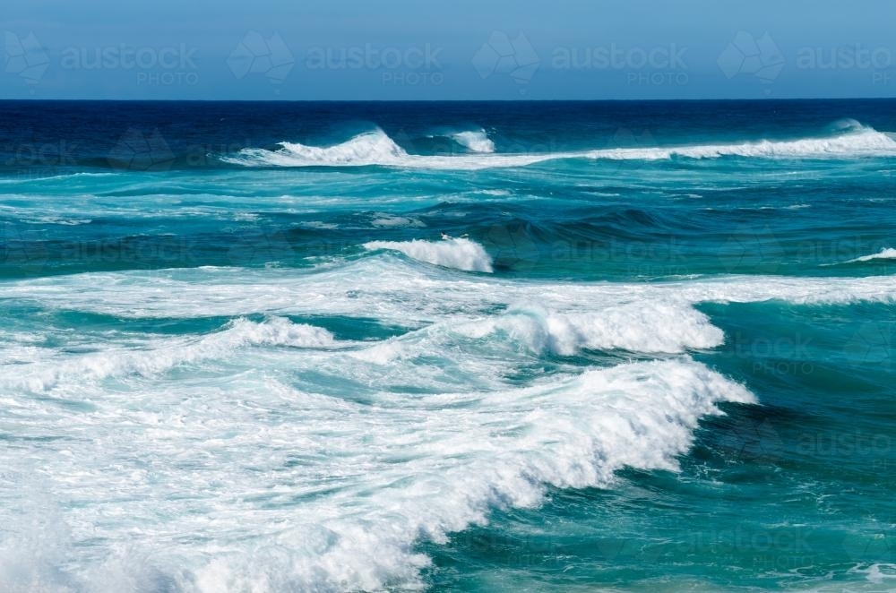 Waves in the blue ocean of Stradbroke Island - Australian Stock Image