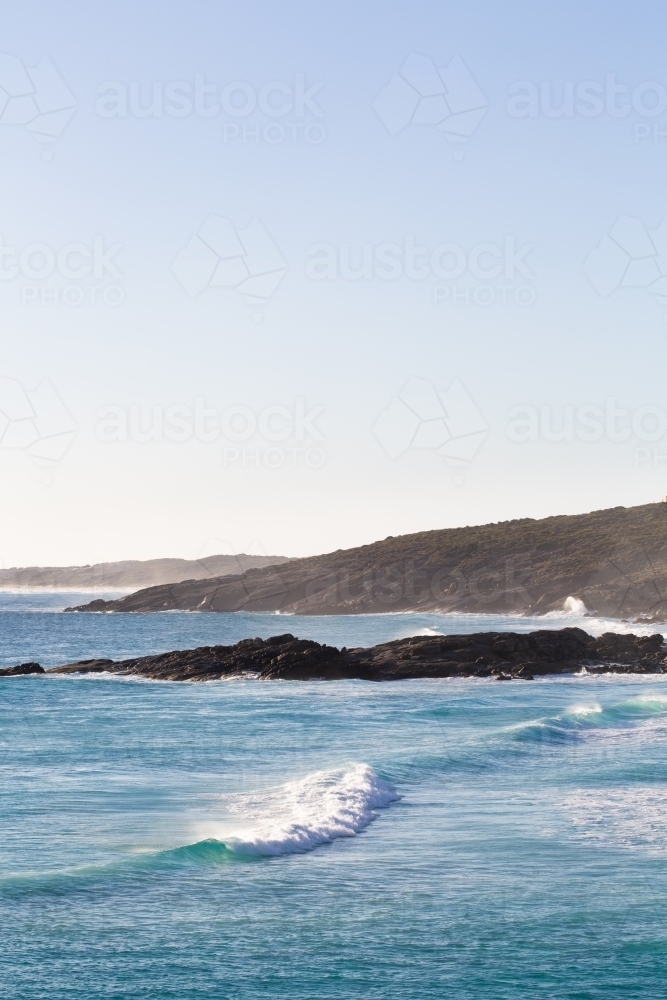 Waves rolling in at south coast surf spot - Australian Stock Image