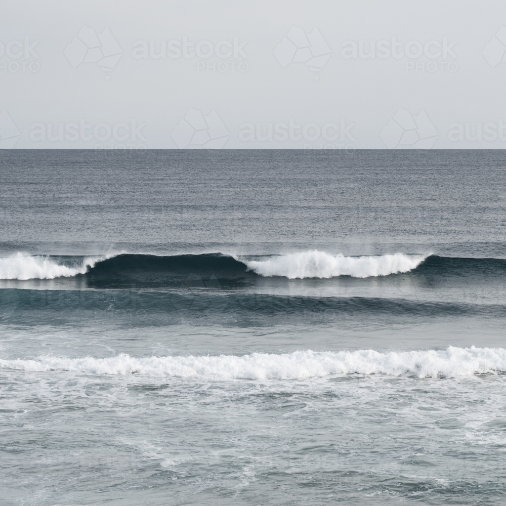 waves rolling in - Australian Stock Image