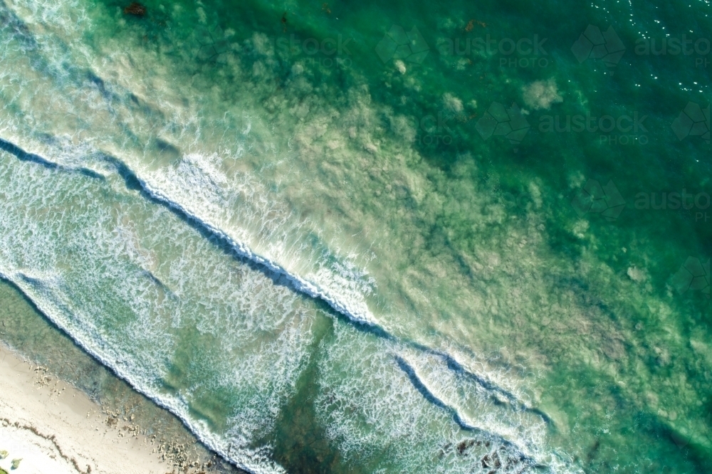 Waves rolling into a shoreline - Australian Stock Image
