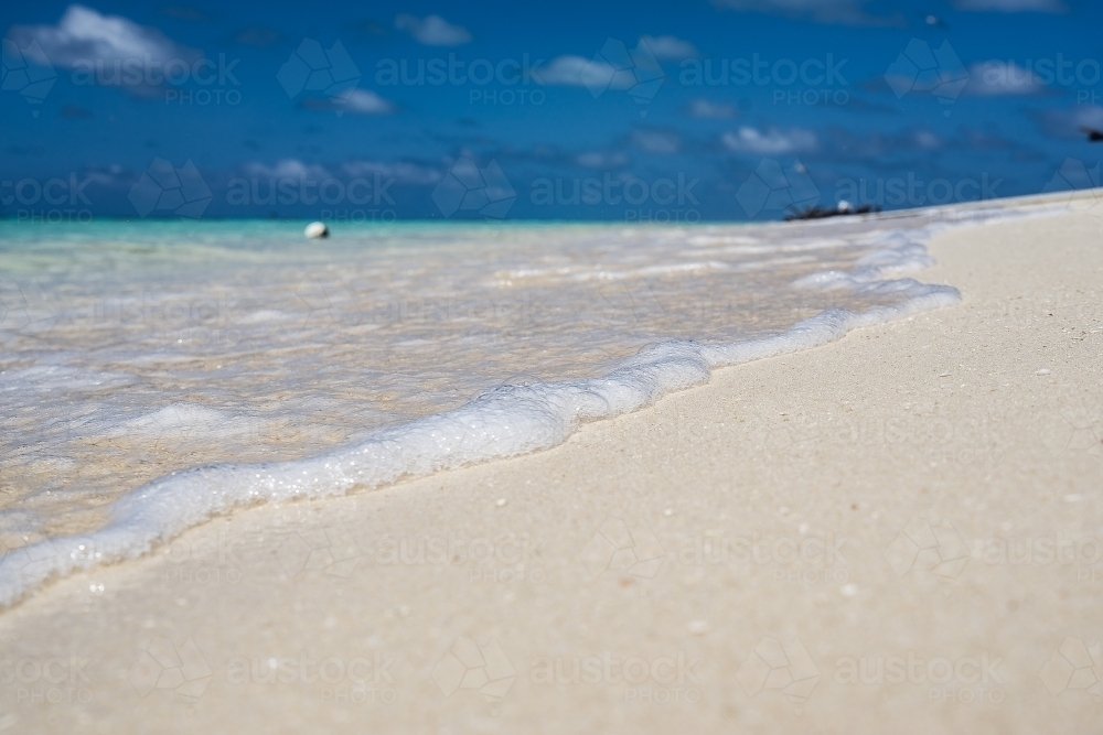 Waves washing on beach - Australian Stock Image