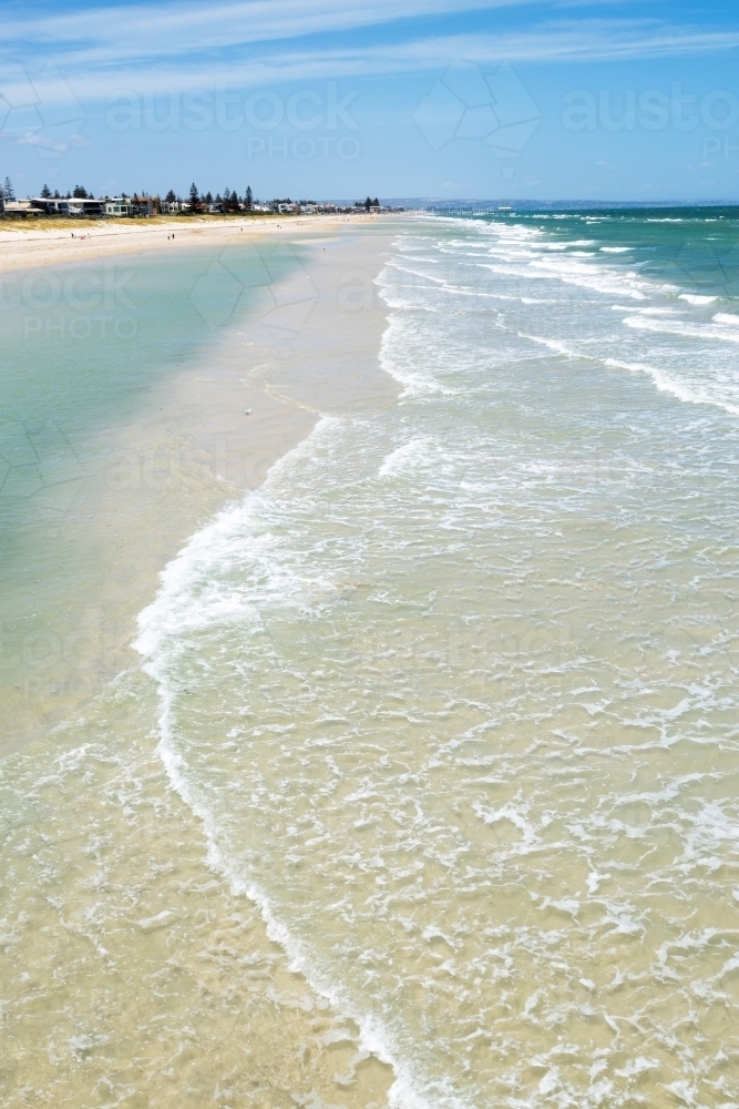 waves washing over sand bar at city beach - Australian Stock Image