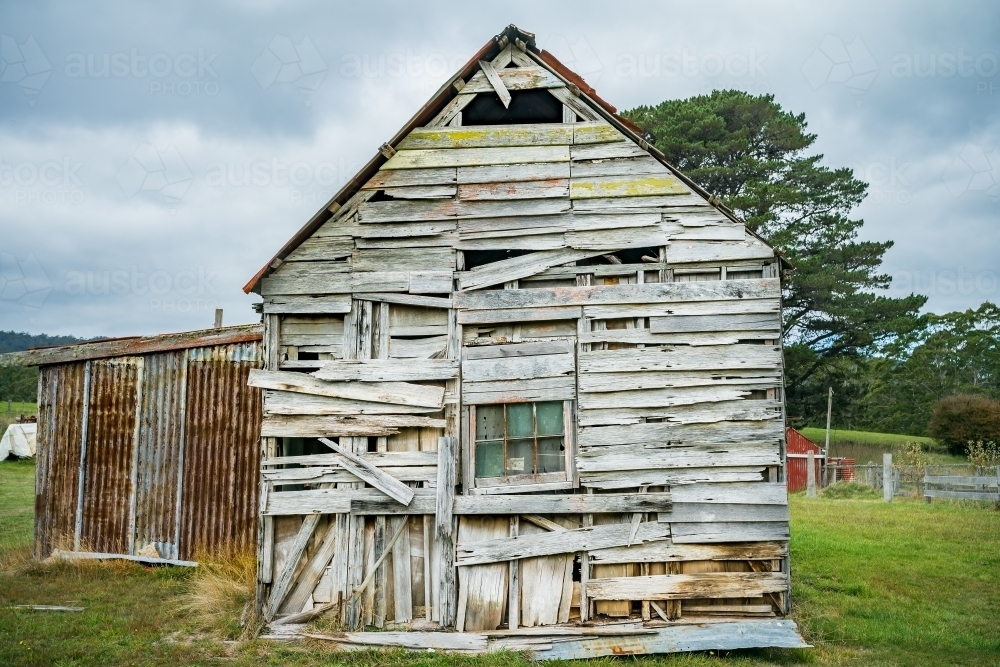 Weatherboards falling off an old wooden shed - Australian Stock Image