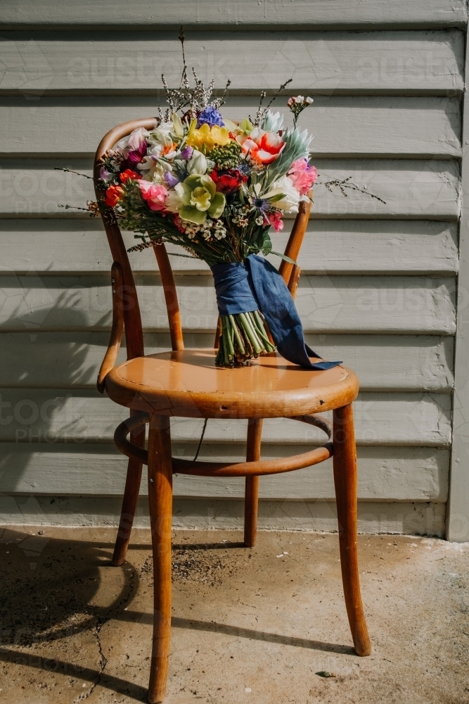 wedding bouquet on a chair. - Australian Stock Image