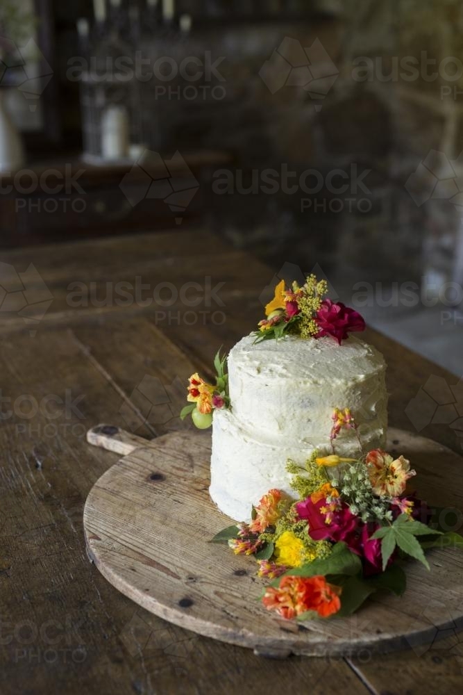 Wedding cake with fresh flowers - Australian Stock Image