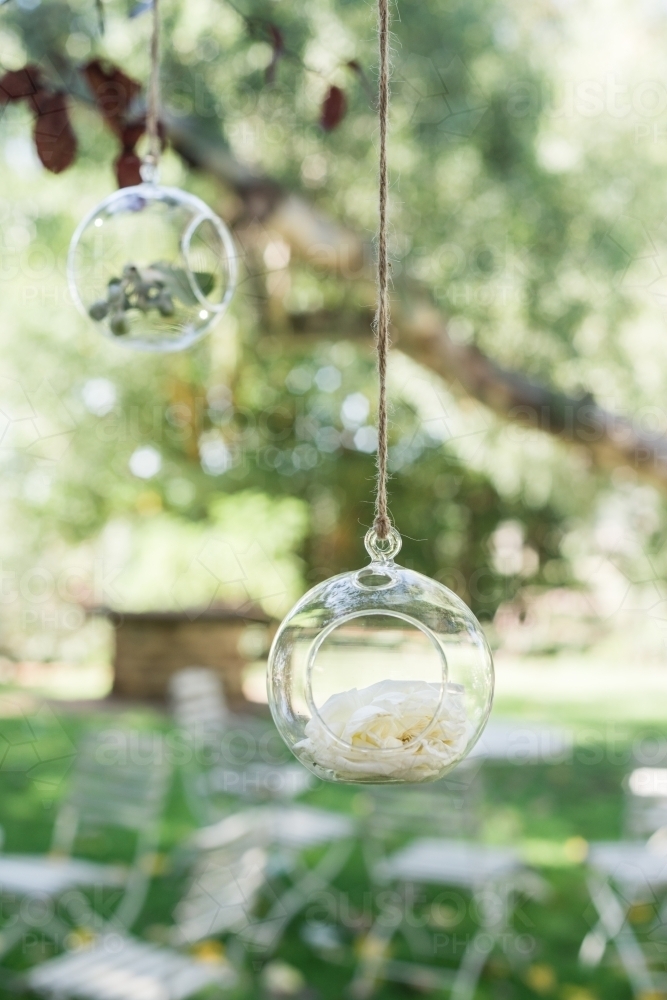 wedding decor, outdoor glass ornament hanging from a tree - Australian Stock Image