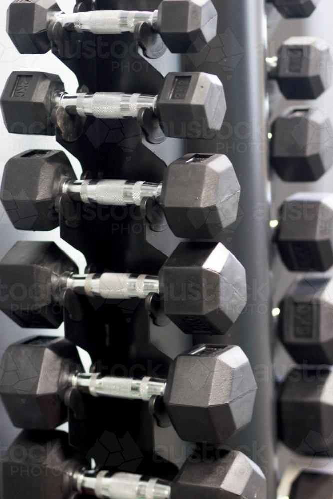 Weights sitting on a rack - Australian Stock Image