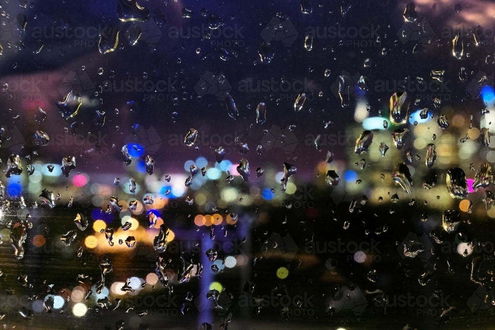 Wet Window with blurred view of Melbourne in Background - Australian Stock Image