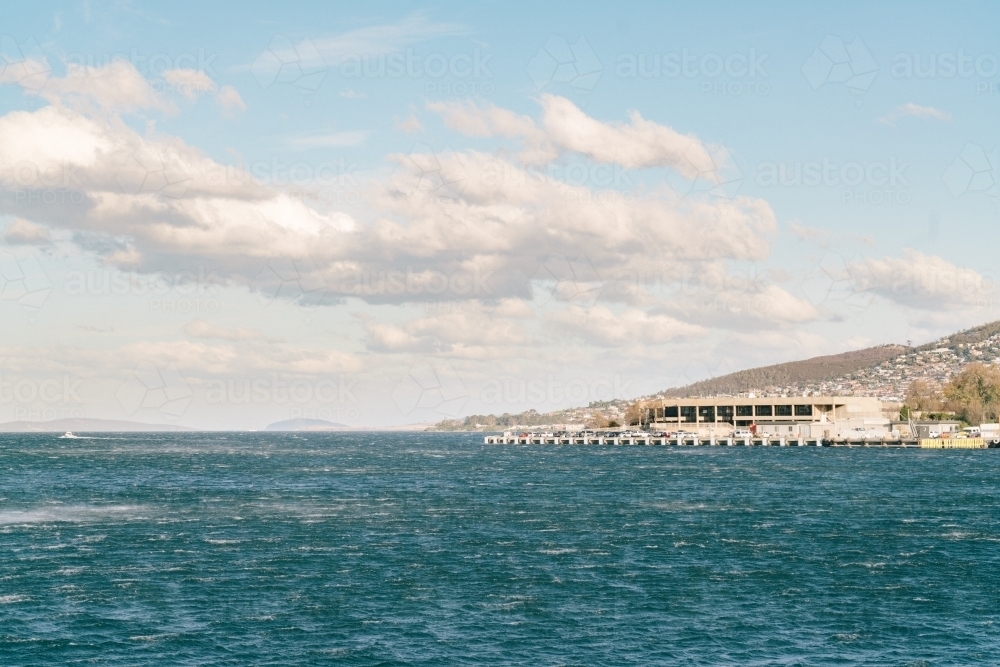 Wharf and ocean on Tasmanian shore - Australian Stock Image