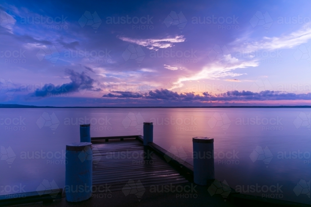 Wharf on lake early morning at sunrise - Australian Stock Image