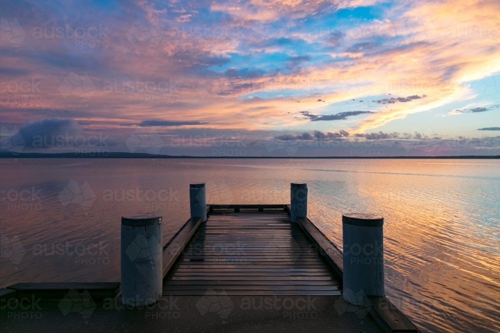 Wharf on lake early morning at sunrise - Australian Stock Image