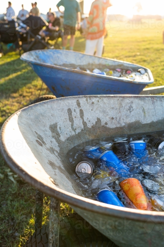 Wheelbarrow at party full of cold soft drinks in cans - Australian Stock Image