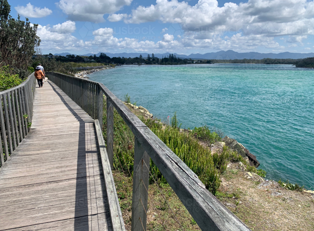 wheelchair friendly boardwalk by a river - Australian Stock Image