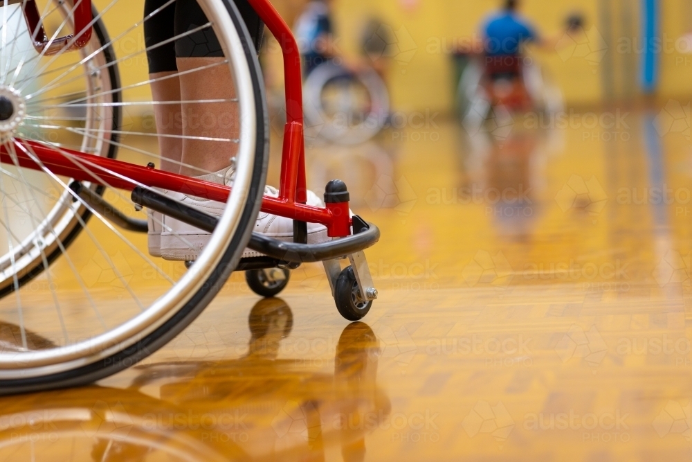 wheelchair on basketball court where wheelchair basketball is being played - Australian Stock Image