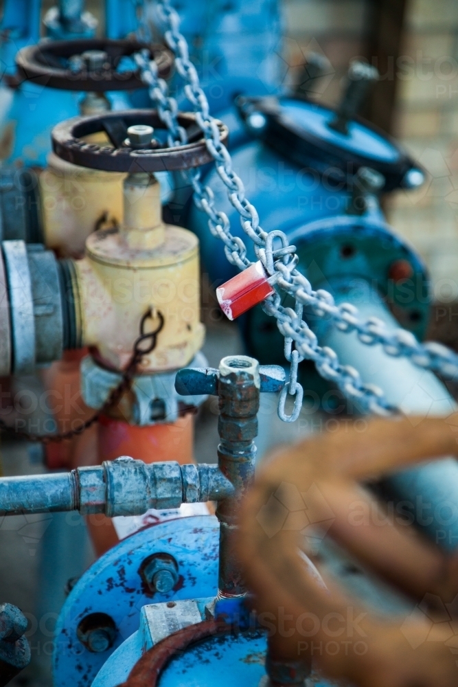 Wheels and chains on a blue water hydrant - Australian Stock Image