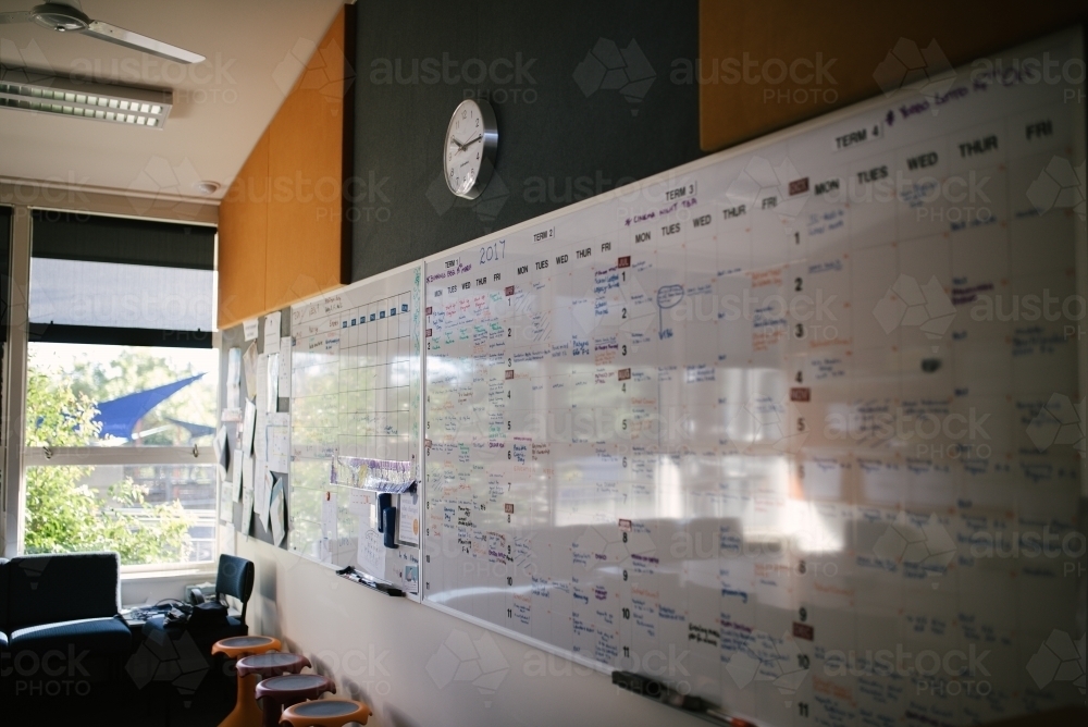 White board planning calendar in a school staff room - Australian Stock Image